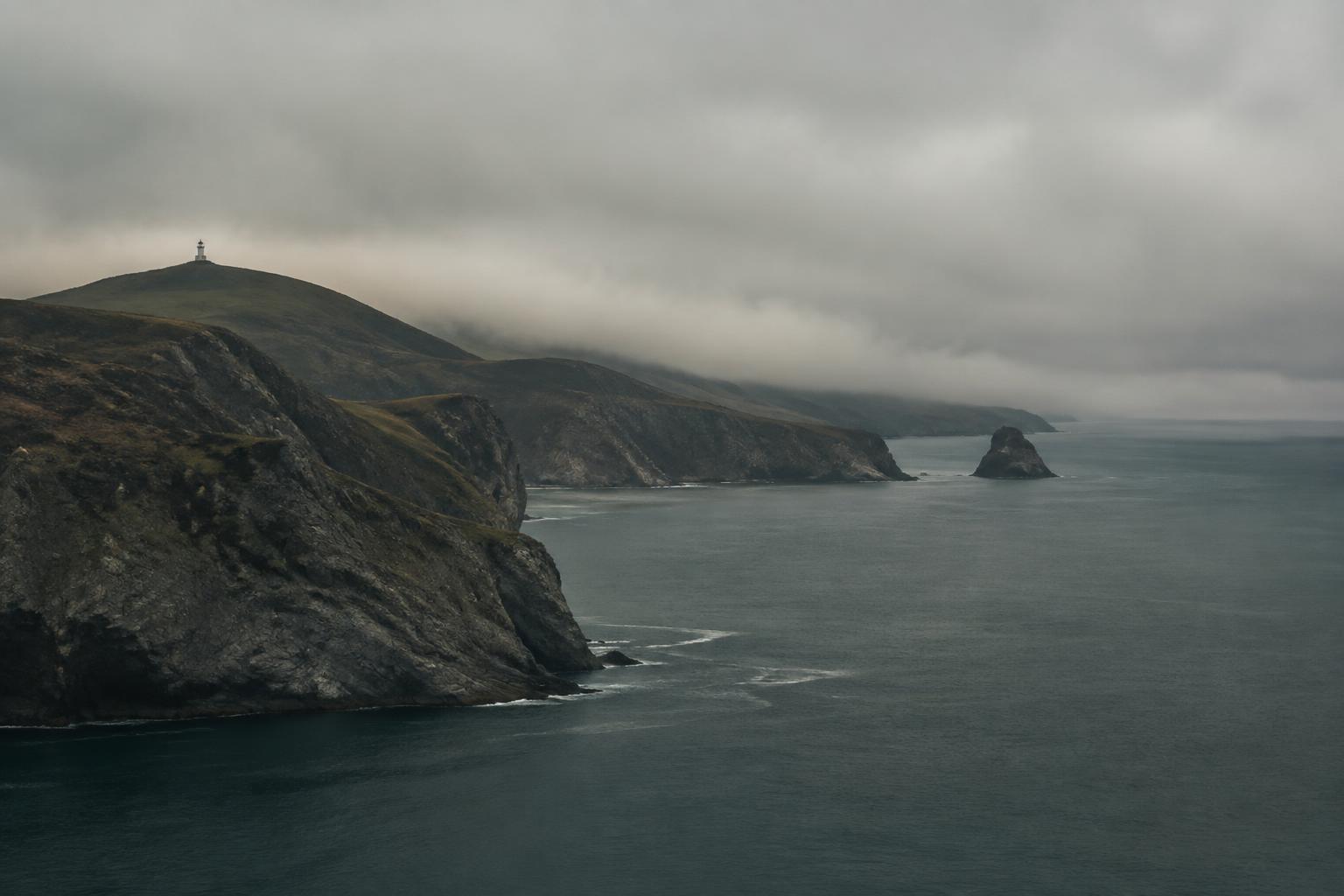 Cliffs and a lighthouse on the Channel Islands coast